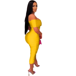 Detail of yellow off-shoulder bodycon dress with side ruching and slim fit design
