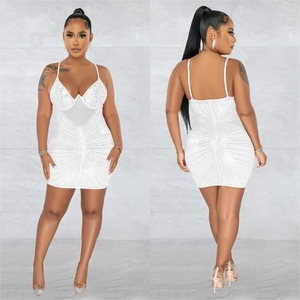 Detail of white sequin bodycon dress with sheer mesh insert and sparkling rhinestones