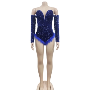 Detail of dark blue sequin romper with plunging V-neck and faux feather trim hem