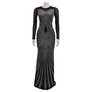 Detail of black mesh neckline and intricate silver rhinestones on evening gown
