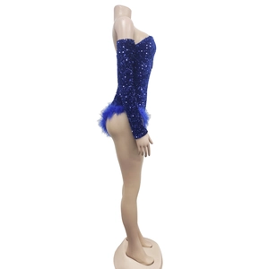 Detail view of royal blue sequined jumpsuit featuring luxury feather trim and long sleeves