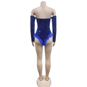 Detailed view of blue sequin romper with faux fur trim and detachable long sleeves