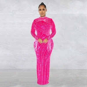 Detail of hot pink gown with silver rhinestone swirls and fringe decor on sleeves