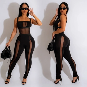 Fashionable black two-piece set featuring mesh patchwork crop top and high waist slim pants