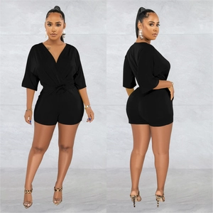 Front and back view of a chic black V-neck romper with drawstring waist and short sleeves