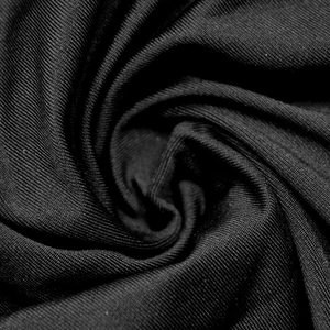 Détail macro de maille côtelée noire élastique avec texture douce et plis en spirale