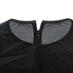 Detail of high-quality invisible back zipper on black mesh evening dress fabric