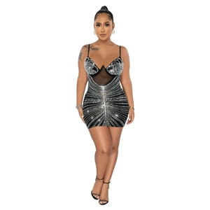 Close-up of black mesh mini dress with rhinestone patterns and thin spaghetti straps