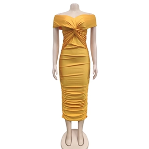 Detailed close-up of ruched texture and twist-knot on a yellow strapless midi dress
