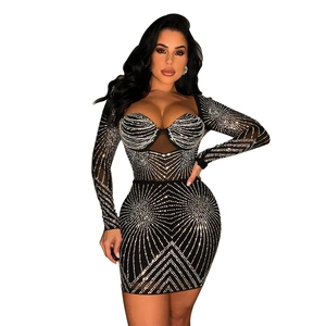 Detail of black mesh mini dress featuring sparkly silver rhinestones in a geometric pattern