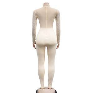 Detail of champagne rhinestone mesh jumpsuit with long sleeves and back zipper closure
