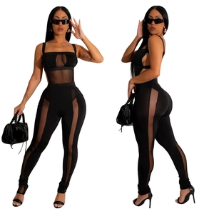 Detail shot of black slim-fit set featuring sheer mesh panels and spaghetti straps
