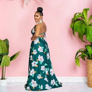 Detail view of dark green floral maxi dress with backless halter design and white patterns