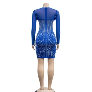 Detail view of bright blue mesh sleeve dress with white rhinestones and back zipper