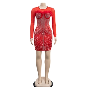 Detail of red bodycon mini dress with luxury feathers, rhinestones, and pearls