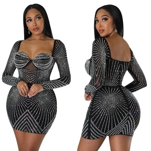 Close-up of mesh sleeves and silver rhinestone stripes on black bodycon dress