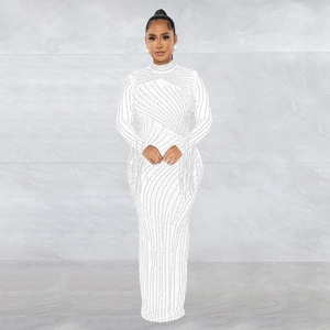 Close-up of white mesh maxi dress with sparkling silver rhinestones and wavy patterns
