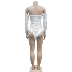 Back view of a white sequined romper set with faux fur trim on a mannequin