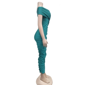 Detail view of ruched pleating and fitted silhouette on cyan off-shoulder maxi dress