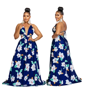 Detail view showing deep V-neckline and crisscross back straps on blue floral maxi dress