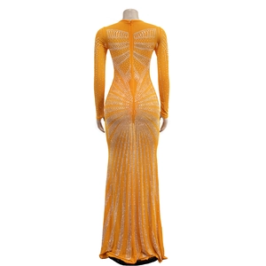 Detail of orange mesh gown featuring sparkling rhinestones and a back zipper closure