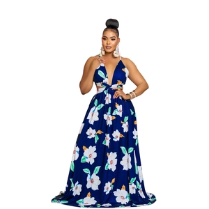 Detail showing deep blue floral print maxi dress with halter neck and side waist cutouts