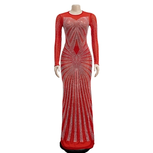 Detail of red mesh evening gown featuring intricate silver rhinestone starburst pattern