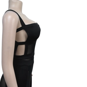 Detail view of black cut-out dress with mesh stitching and elastic fabric on a mannequin