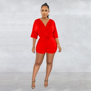 Front view of a vibrant red V-neck romper with waist tie and half sleeves detail