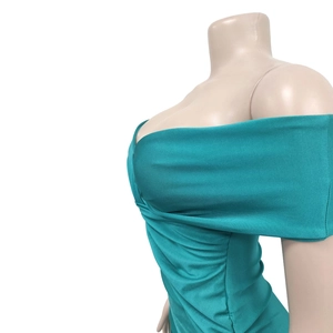 Detail view of turquoise off-shoulder maxi dress with ruched cross-over bust design