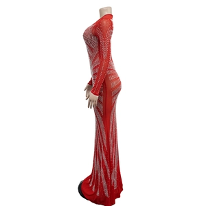 Detailed view of red sheer mesh maxi dress featuring glittering silver rhinestone patterns