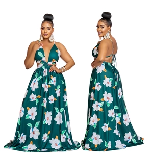 Detail of dark green floral maxi dress featuring deep V-neck and waist cut-out design