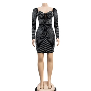 Detailed view of black mesh mini dress with sparkling rhinestones and sweetheart neckline
