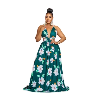 Detail of deep V-neck floral maxi dress with waist cut-outs and bold flower prints