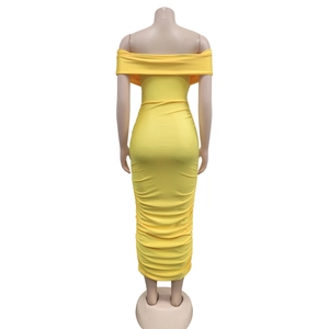 Rear view of yellow off-shoulder ruched maxi dress showing bodycon fit and pleated fabric