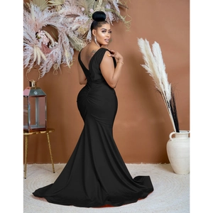 Detailed view of the elegant ruched back and sleek mermaid silhouette of this black dress