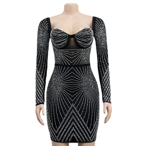Detail view of black bodycon mini dress featuring silver rhinestone geometric patterns