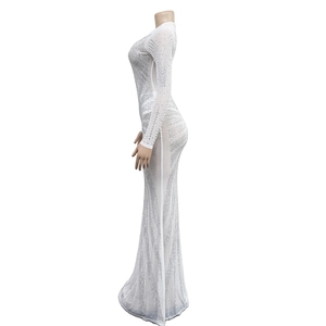 Detail showing white mesh long sleeve dress with silver rhinestone wave patterns
