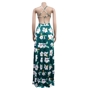 Detail of bohemian backless halter top with green floral pattern and cross ties