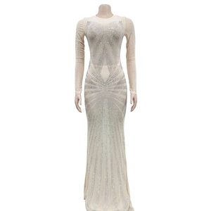 Detailed view of silver rhinestones in geometric patterns on a nude long sleeve maxi dress