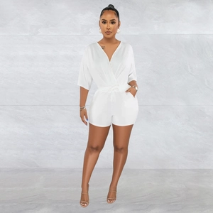 Detailed front view of white V-neck romper with drawstring waist on minimalist background
