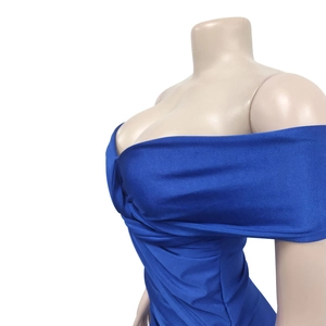 Detail view of royal blue strapless dress featuring elegant pleated and knotted bodice details