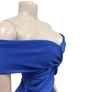 Detail of blue off-shoulder dress featuring ruched chest design and elastic knit fabric