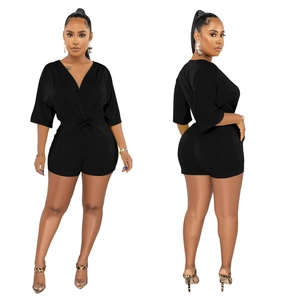 Detailed view of women's black V-neck romper with drawstring waist and mid-length sleeves