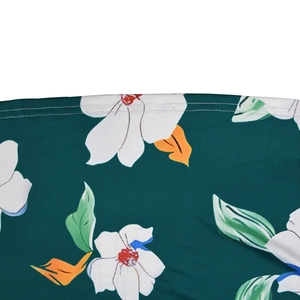 Detailed macro view of floral print fabric with premium white double stitching