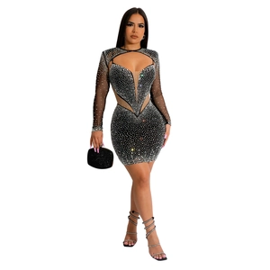 Close-up of sparkling rhinestones and sheer mesh sleeves on this black party dress