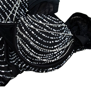 Detail of black mesh dress featuring luxury silver rhinestone patterns and sturdy underwire