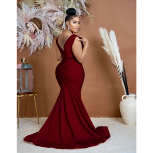 Detailed back view of a burgundy V-neck backless evening gown with pleated fishtail hem