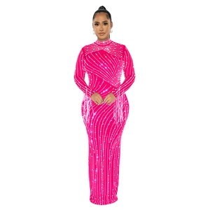 Detail of hot-fix rhinestones and fringe sleeves on a fuchsia mesh bodycon maxi dress