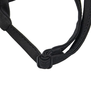 Detail of adjustable black mesh fabric strap with a durable plastic buckle for fit